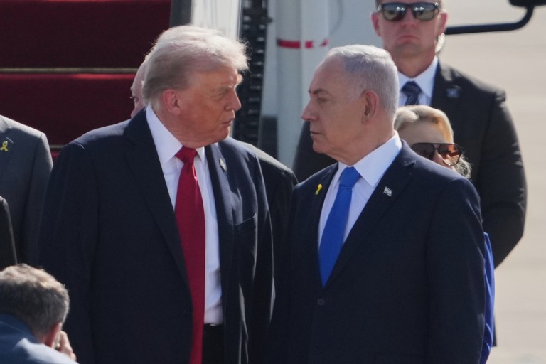 President Donald Trump, center, talks with Israel's Prime Minister Benjamin Netanyahu