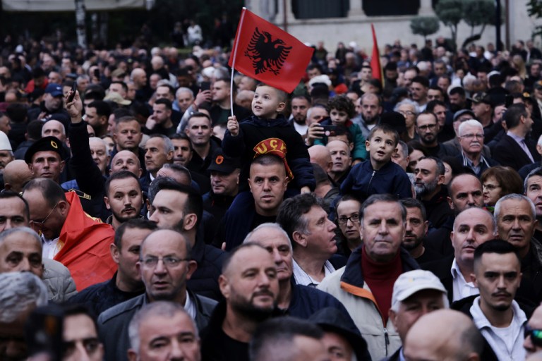 Protesters take part in a rally at Skanderbeg square in central Tirana, Albania, Friday, Oct. 17, 2025, against war crimes trials being pursued against some of their leaders in The Hague.
