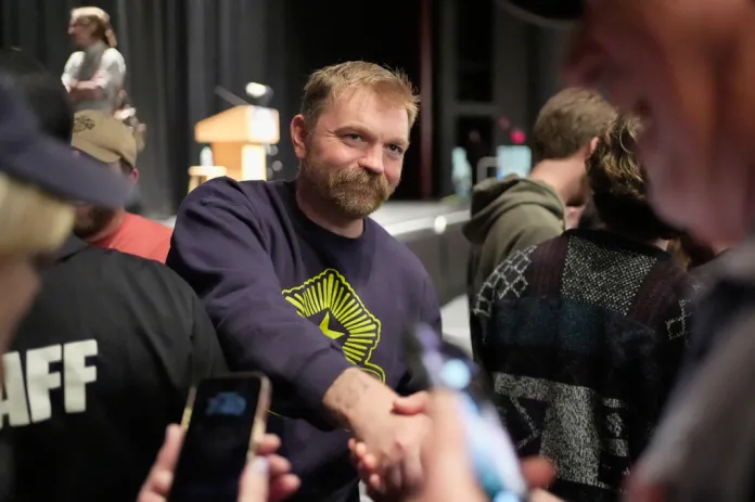 Graham Platner, Democratic candidate for U.S. Senate, greets supporters after speaking at an event hosted by Sen. Bernie Sanders in Orono, Maine, Sunday, May 24, 2026