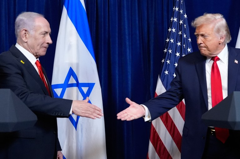 President Donald Trump shakes hands with Israel's Prime Minister Benjamin Netanyahu at the end of a news conference at Mar-a-Lago, Dec. 29, 2025, in Palm Beach, Fla. (AP Photo/Alex Brandon)