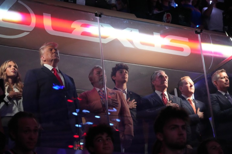 President Donald Trump gestures during the National Anthem at the NBA Finals