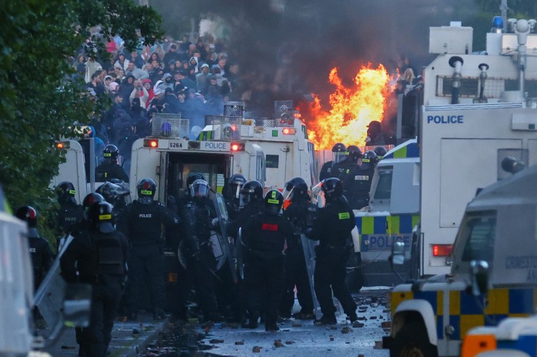 Police attempt to clear protesters near Newtownabbey, in Belfast, Northern Ireland.
