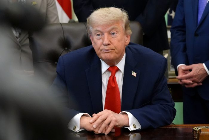 President Donald Trump listens during an event to sign a proclamation about the fishing industry, in the Oval Office of the White House, Thursday, June 11, 2026, in Washington. (AP Photo/Jacquelyn Martin)