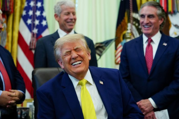 President Donald Trump laughs during an event in the Oval Office of the White House, Thursday, June 4, 2026, in Washington.