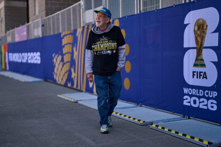 A man walks past the Lumen Field stadium during the 2026 FIFA World Cup in Seattle.