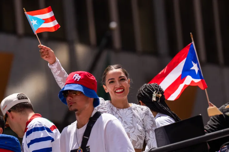 Rep. Alexandria Ocasio-Cortez (D-NY) takes part in the National Puerto Rican Day Parade.