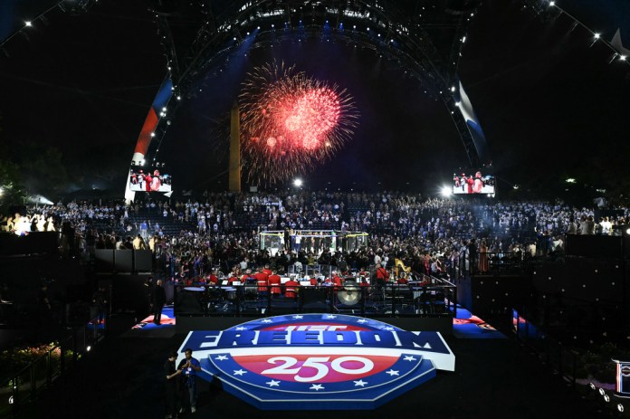 Fireworks go off as Justin Gaethje celebrates after defeating Ilia Topuria in a lightweight title bout during UFC Freedom 250 on the South Lawn of the White House, Monday, June 15, 2026, in Washington.