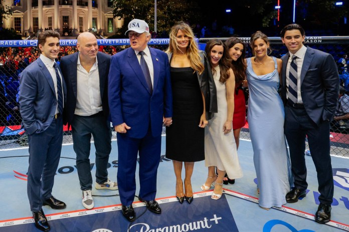 President Donald Trump, first lady Melania Trump, UFC President and CEO Dana White and other guests pose inside the octagon after UFC Freedom 250 on the South Lawn of the White House, Monday, June 15, 2026, in Washington. (Evan Vucci/Pool Photo via AP)