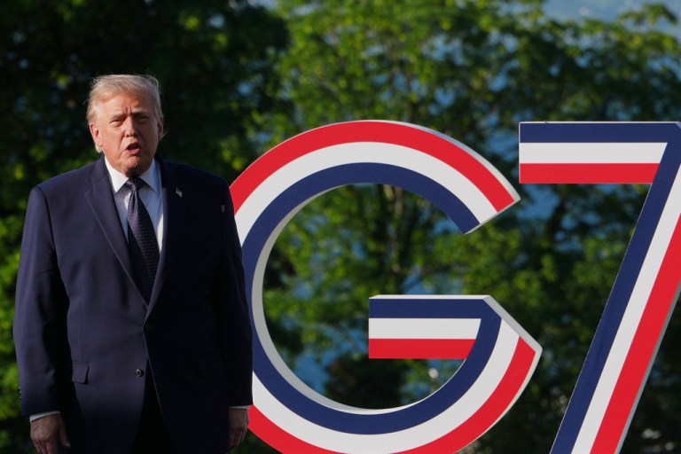 President Donald Trump talks as he greets France's President Emmanuel Macron and first lady Brigitte Macron at the G7 summit, Monday, June 15, 2026, in Evian-les-Bains, France.