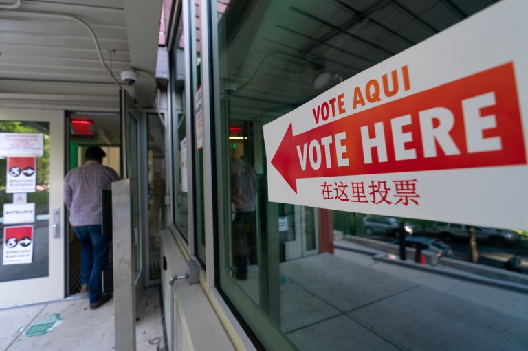 People arrive to their polling station during D.C. primary election at Shepard Park Elementary, Tuesday, June 16, 2026, in Washington. (AP Photo/Jose Luis Magana)
