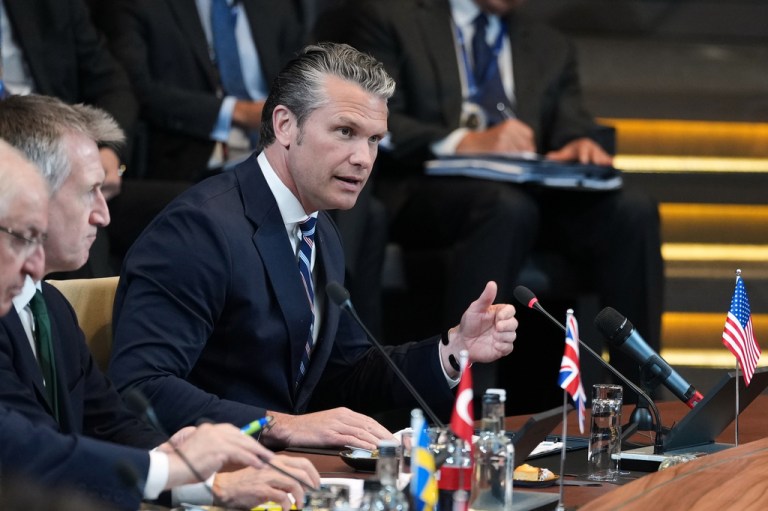Pete Hegseth speaks during a NATO meeting.