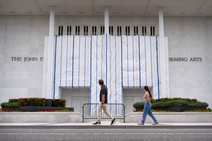 Kennedy Center with tarp covering Donald Trump's name
