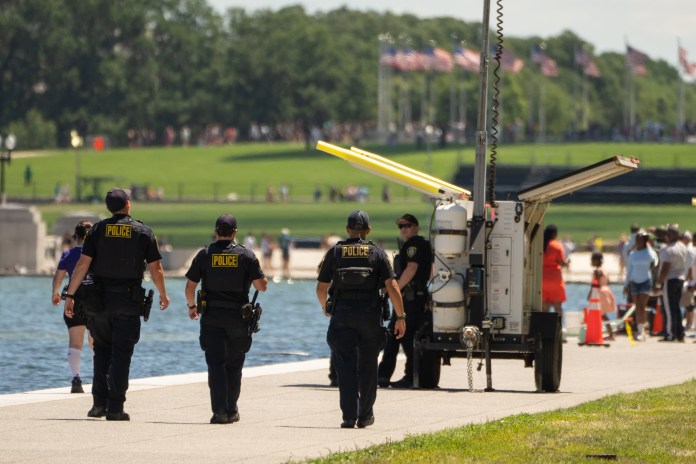 Law enforcement patrolling Reflecting Pool
