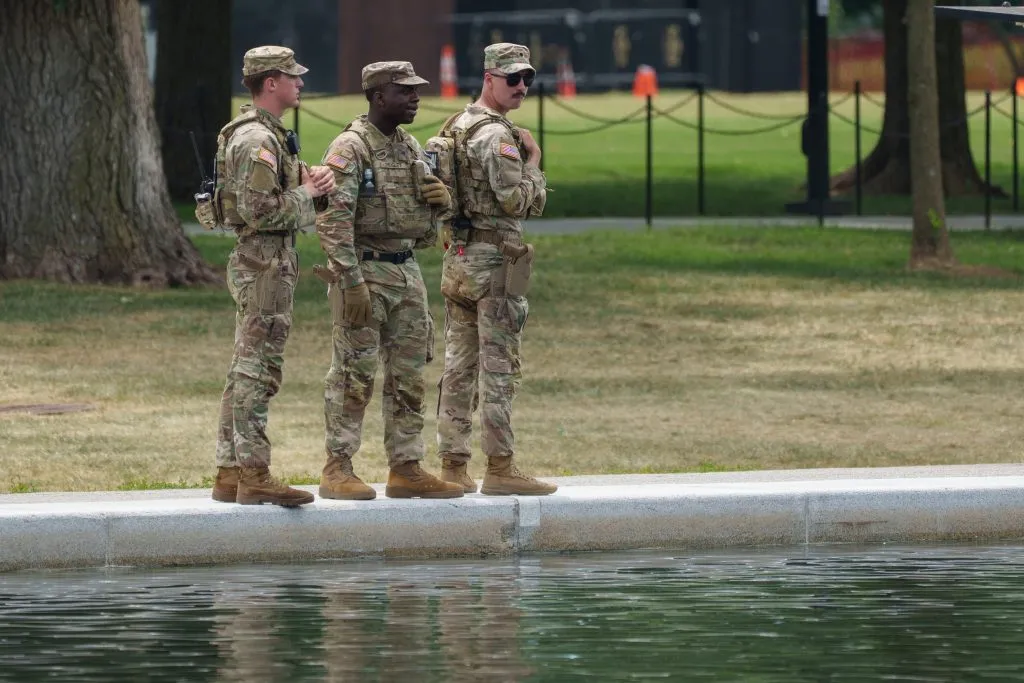 Law enforcement officers descend on Reflecting Pool after Trump claims vandalism