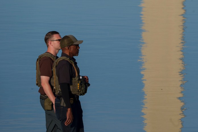 Law enforcement patrolling Reflecting Pool