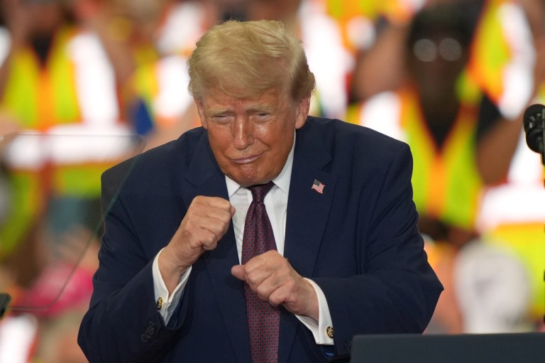 President Donald Trump gestures during a visit to the Lehigh Valley operations facility for Mack Trucks.