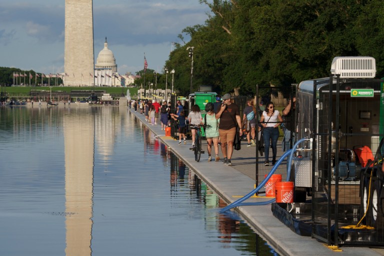 People walk along the Lincoln Memorial Reflecting Pool