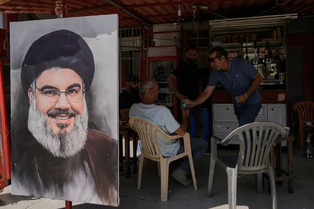 A portrait of former Hezbollah leader Hassan Nasrallah hangs on a coffee shop in the town of Nabatiyeh, southern Lebanon, Wednesday, June 24, 2026, after a ceasefire between Israel and Hezbollah.