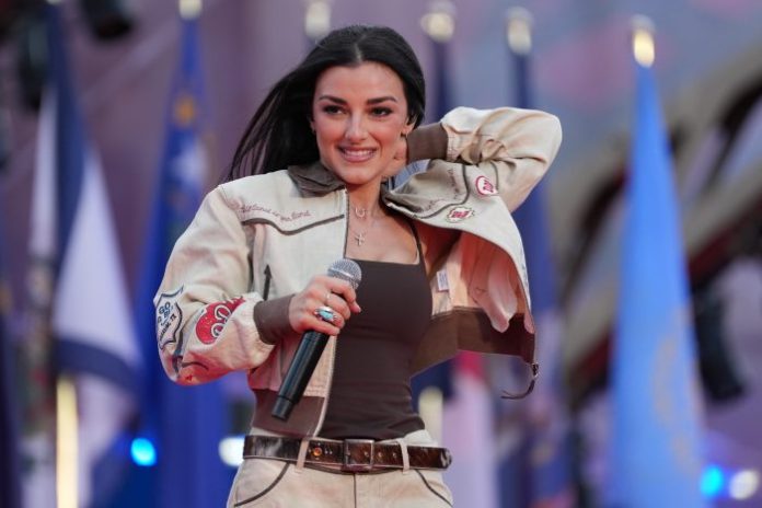 Technical error forces Kash Patel’s girlfriend to sing national anthem twice during Brussels Freedom 250 event