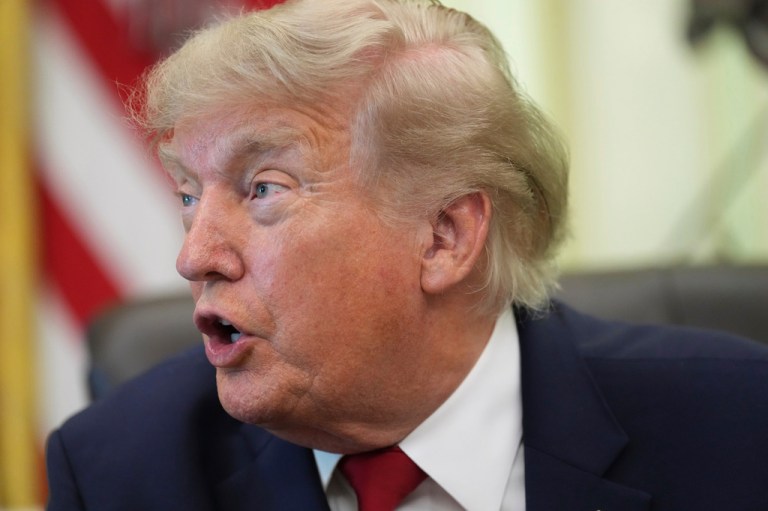 President Donald Trump speaks before signing a presidential memo to the EPA on pollution control in vehicles, in the Oval Office of the White House.