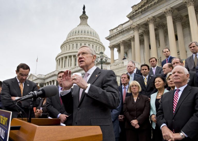 Senate Majority Leader Harry Reid, D-Nev., and Senate Democrats gather outside the Capitol to urge Speaker of the House John Boehner, R-Ohio, and other House Republicans, to break the impasse on a funding bill and stop the government shutdown that is now in its second week, Wednesday, Oct. 9, 2013, in Washington. Washington, D.C. Mayor Vincent Gray listens at left. (AP Photo/J. Scott Applewhite)