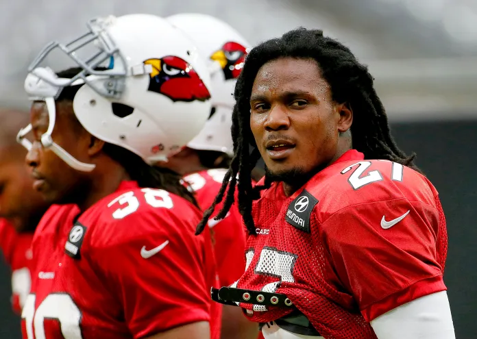 Arizona Cardinals running back Chris Johnson participates in an NFL football training camp, Tuesday, Aug. 18, 2015, in Glendale, Ariz. (AP Photo/Matt York)