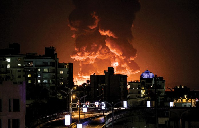 A large plume of smoke rises over Tehran, March 7, 2026. (Getty Images)