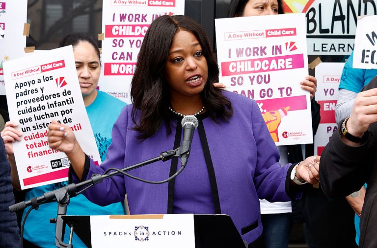 Janeese Lewis George speaks at a podium