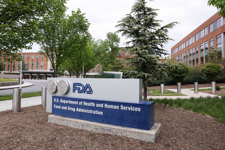 Signage outside the US Food and Drug Administration headquarters in Silver Spring, Maryland, US, on Tuesday, April 28, 2026. The US Food and Drug Administration plans to cut the time it takes drug companies to test new medicines by getting more visibility into clinical trials as they're underway. Photographer: Valerie Plesch/Bloomberg via Getty Images