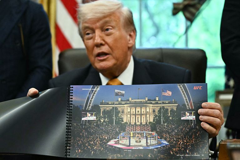 President Donald Trump shows a rendering of the upcoming 