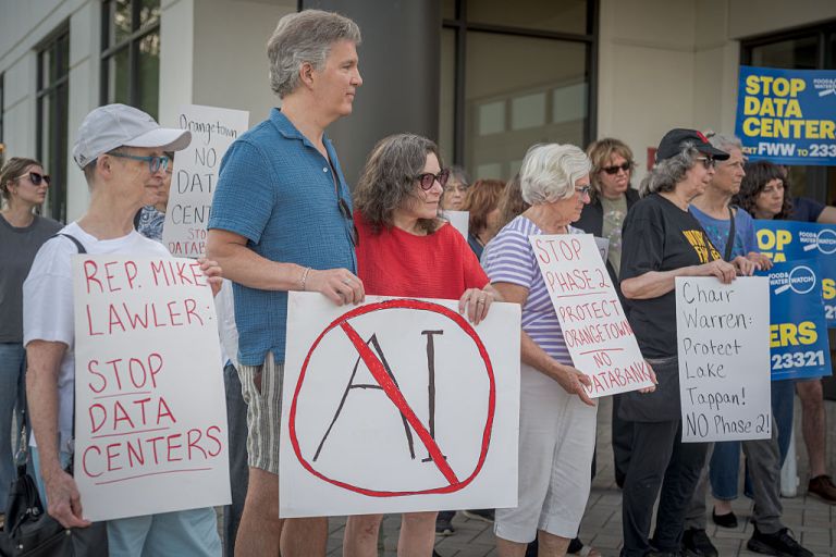 Participants seen holding signs at the protest. Concerned Rockland County residents joined members of Food & Water Watch, Indivisible Rockland and the Bi-State Data Center Crisis Coalition of NY/NJ outside the Orangetown Town Hall building in Orangeburg, New York for a rally after the Planning Board abruptly canceled the scheduled meeting, stopping residents -in their opinion- to raise their voice in opposition to DataBank's proposal to build another data center in Orangeburg. (Photo by Erik McGregor/LightRocket via Getty Images)