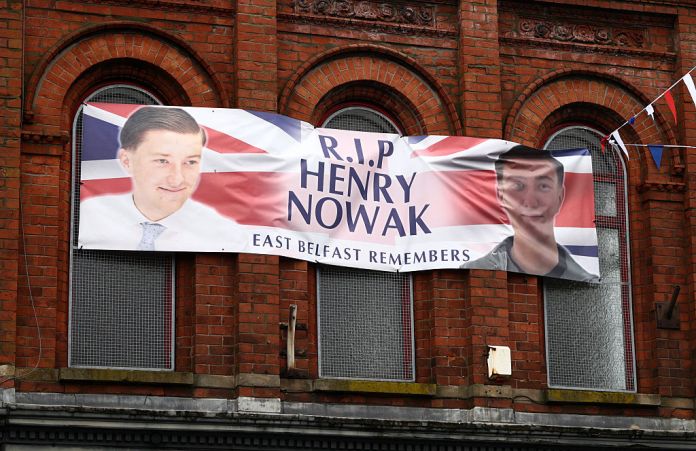 A poster in remembrance of stabbing victim Henry Nowak, killed in Southampton in December 2025, is pictured in Newtownards, east of Belfast, Northern Ireland, on June 11, 2026, following two consecutive nights of violence following the June 8 stabbing of Stephen Ogilvie, that triggered the unrest. Police arrested 16 people during a second night of disorder on June 10, in Northern Ireland sparked by the brutal Belfast stabbing of Stephen Ogilvie, a senior minister said Thursday, condemning rioters for "racist thuggery". (Photo by Henry NICHOLLS / AFP via Getty Images)