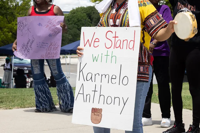 Supporters of Karmelo Anthony chant outside of the Collin County Courthouse as Anthony's murder trial is underway in McKinney, TX, Saturday, June 6, 2026. Anthony is accused of killing 17-year-old Austin Metcalf last April at a Frisco track meet at David Kuykendall Stadium. (Juan Figueroa/The Dallas Morning News via Getty Images)