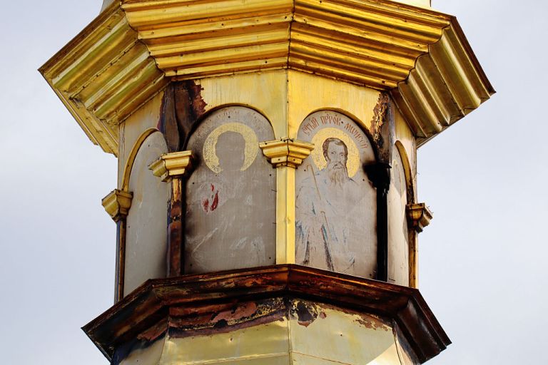 Fire-destroyed frescoes of Orthodox saints are visible on one of the domes of the Dormition Cathedral of the Kyiv Pechersk Lavra (a UNESCO World Heritage Site) on June 17, 2026 in Kyiv, Ukraine. Workers clear debris at the Dormition Cathedral of the Kyiv Pechersk Lavra, a UNESCO World Heritage Site, after it was damaged in a Russian drone strike on June 15. The attack destroyed the cathedral's roof, damaged one of its altars and destroyed exterior frescoes of Orthodox saints. A fire caused by the strike took nearly 24 hours to extinguish. (Photo by Andriy Zhyhaylo/Oboz.ua/Global Images Ukraine via Getty Images)