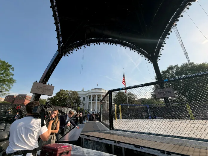 Members of the press gathering their take on the main venue for UFC Freedom 250, ahead of the fight on Sunday, June 14. (Judith Y. Kim/Washington Examiner)