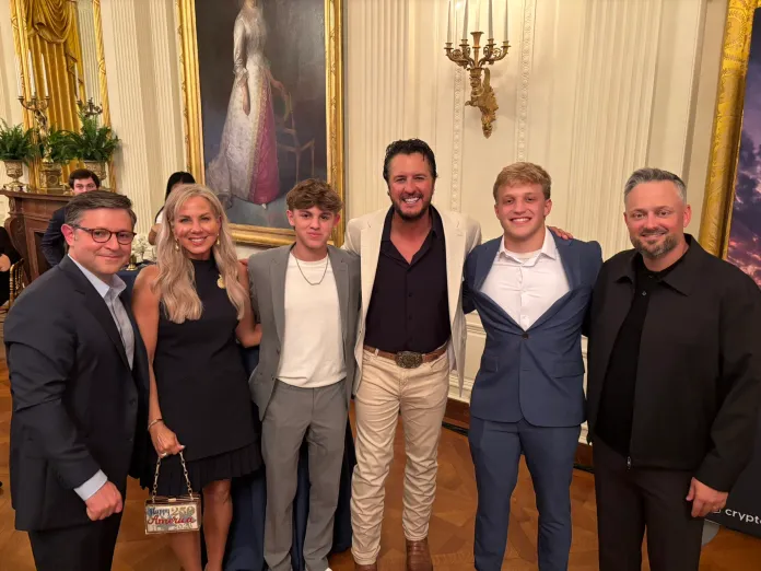 House Speaker Mike Johnson stands with Country Music singer Luke Bryan and his family during the UFC Freedom 250 fight at the White House. (Photo Courtesy/ Mike Johnson X account)