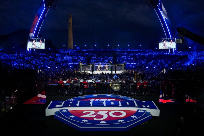 Featherweight fighters Diego Lopez and Steve Garcia compete in the ring during the first fight at UFC Freedom 250 on the South Lawn of the White House, Sunday, June 14, 2026, in Washington. (AP Photo/Julia Demaree Nikhinson)
