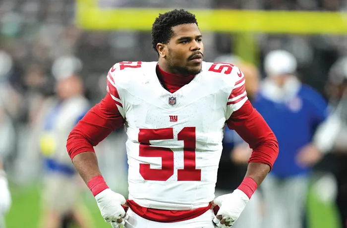 New York Giants linebacker Abdul Carter walks on the field before a game against the Las Vegas Raiders on Dec. 28 in Las Vegas. (John Locher/ap)