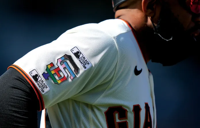 A member of the San Francisco Giants wears a jersey with patches saying “Black Lives Matter” and the Giants logo in rainbow colors that symbolize the LGBT community. (Thearon W. Henderson/Getty Images)