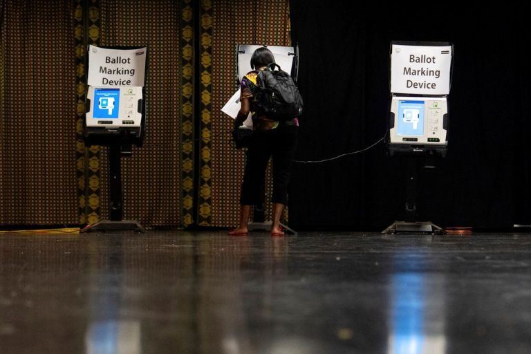 A voter in Washington, D.C., casts a ballot.