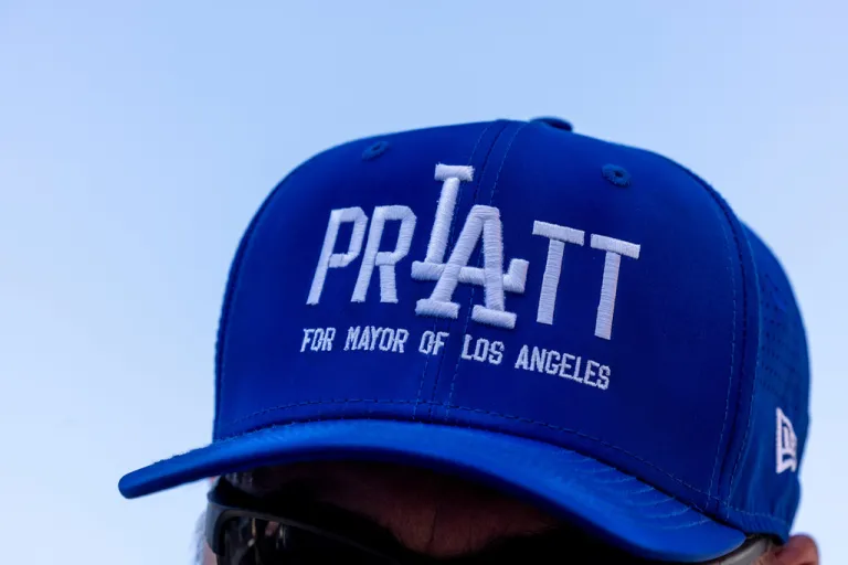 A man wearing a hat supporting Los Angeles mayoral candidate Spencer Pratt during a campaign event.