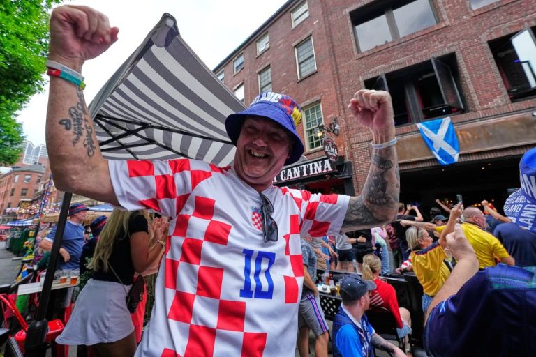 A Croatia fan celebrates a goal
