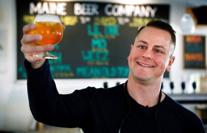 In this May 7, 2015 file photo, Dan Kleban, a co-owner of the Maine Beer Company, poses in the company's tasting room in Freeport, Maine. Democrats angry over Republican Sen. Susan Collins' vote for Supreme Court nominee Brett Kavanaugh are champing at the bit to unseat her and there's a crowd-sourced nest egg awaiting her challenger. But so far, no big-name Democrats have formally announced they'll challenge Collins, in 2020. Kleban is among Democrats who've stated interest in running for the seat. (AP Photo/Robert F. Bukaty, File)