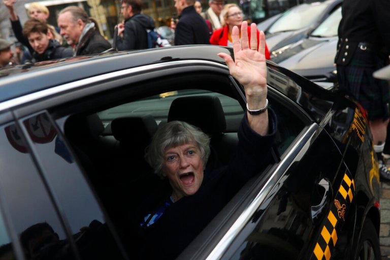 British MEP Ann Widdecombe gestures as she leaves with other party members the European Parliament in Brussels to take the Eurostar train back to Britain, Friday, Jan. 31, 2020. The U.K. is due to leave the EU on Friday the first nation in the bloc to do so.