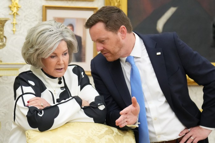 White House chief of staff Susie Wiles talks with Chris Klomp