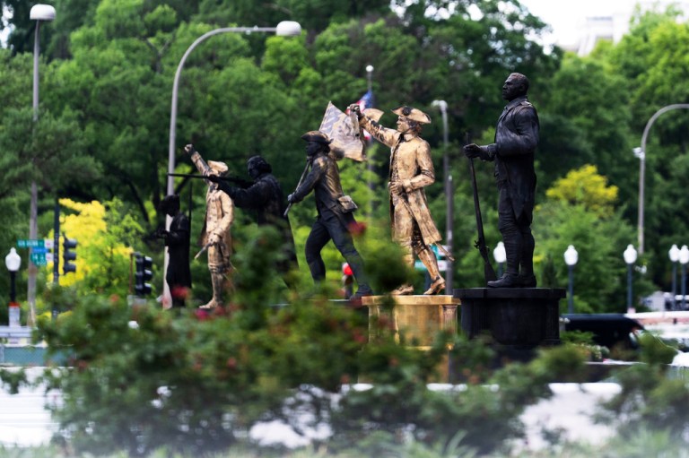 Bronze statues are seen installed at the fence-off Freedom Plaza in Washington, Thursday, May 28, 2026. (AP Photo/Manuel Balce Ceneta)