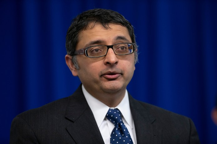 Dr. Nirav Shah, director of the Maine Center for Disease Control and Prevention, speaks at a news conference, April 28, 2020, in Augusta, Maine.