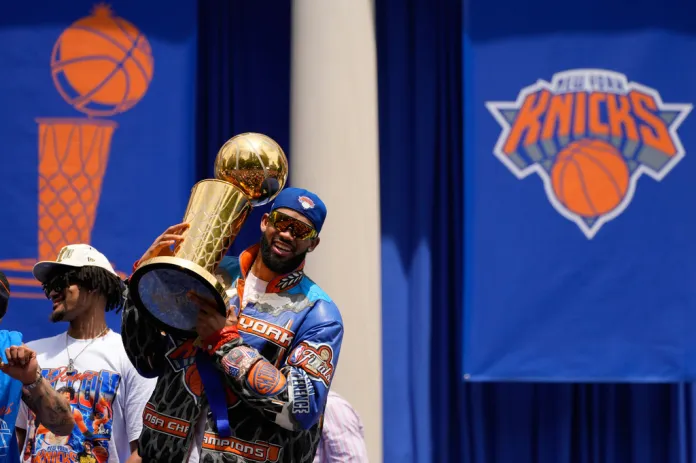 New York Knicks center Karl-Anthony Towns celebrates during the New York Knicks' NBA championship parade Thursday, June 18, 2026, in New York. (AP Photo/Yuki Iwamura)