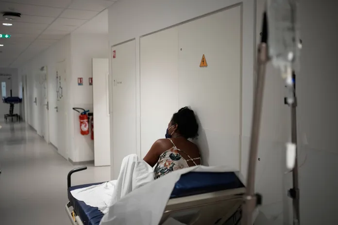 A patient waits before being treated at the emergency department of the Paris-Saclay Hospital, outside Paris, Tuesday June 30, 2026. (AP Photo/Christophe Ena )