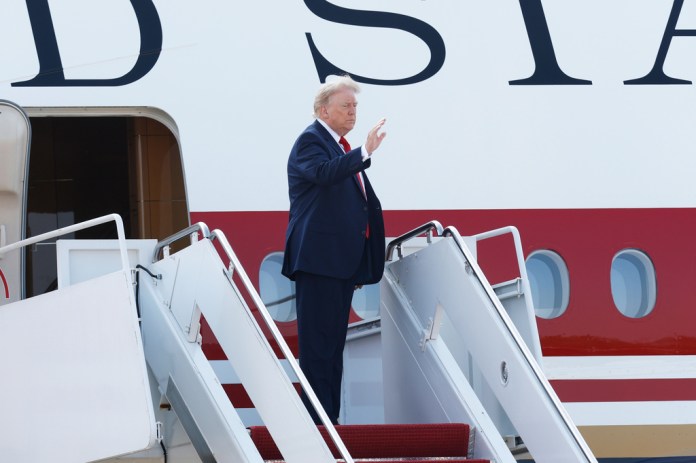President Donald Trump waves as he boards the newly-designated Air Force One, a formerly Qatari-owned jumbo jet that has been converted into the official U.S. presidential aircraft, at Joint Base Andrews, Md., Wednesday, July 1, 2026, to attend the opening of the Theodore Roosevelt Presidential Library in Medora, N.D. (AP Photo/Luis M. Alvarez)